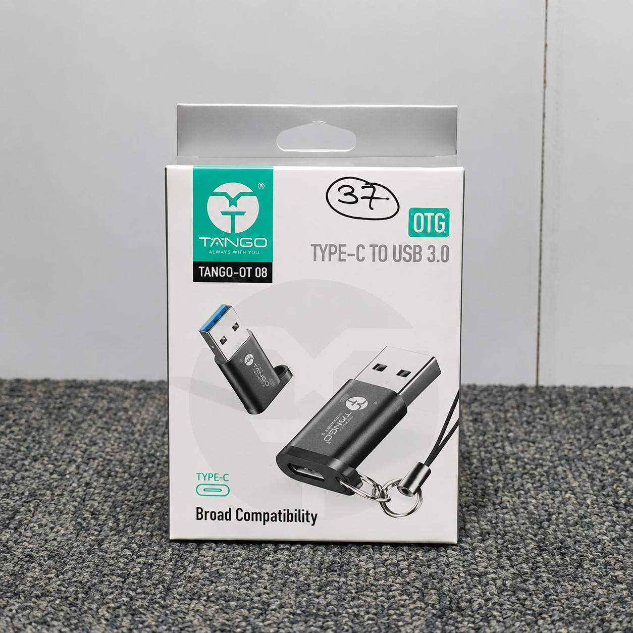 Packaging of a Type-C to USB 3.0 adapter with TANGO branding on a gray surface.